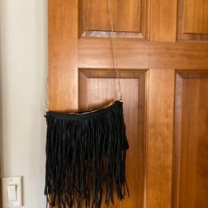 Cute black purse with gold chain strap.